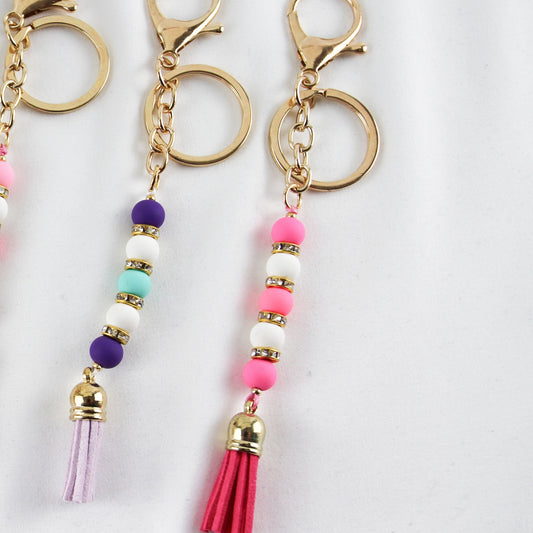 Pearl Tassel Pop – Farbfroher Perlen-Schlüsselanhänger mit Strass & Quaste