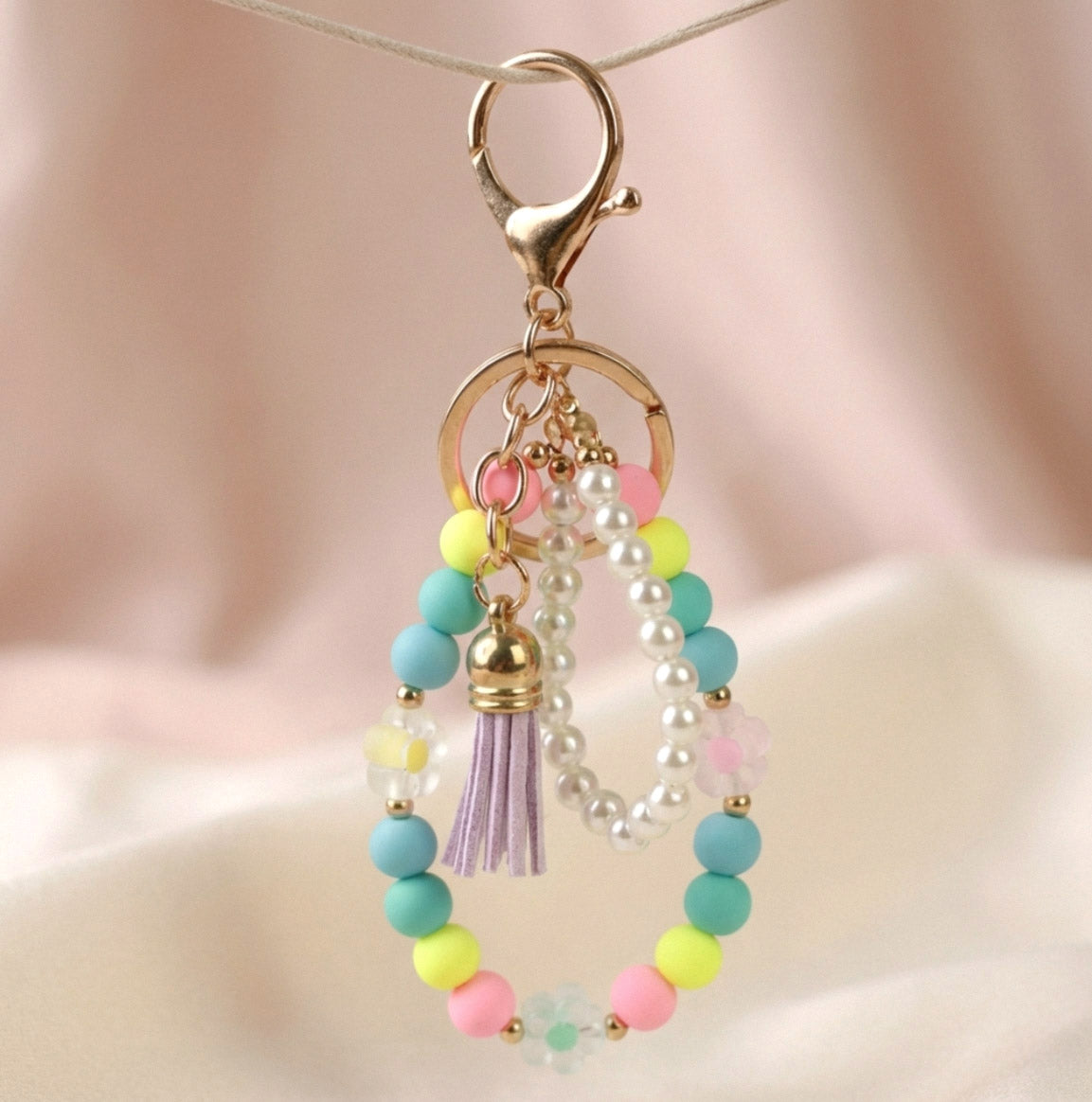 Happy – Bunter handgefertigter Perlen-Schlüsselanhänger mit Quaste