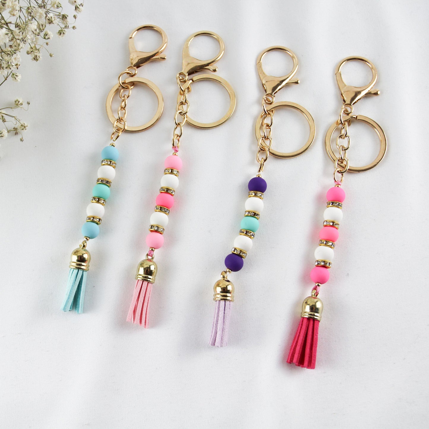 Pearl Tassel Pop –  Farbfroher Perlen-Schlüsselanhänger mit Strass & Quaste