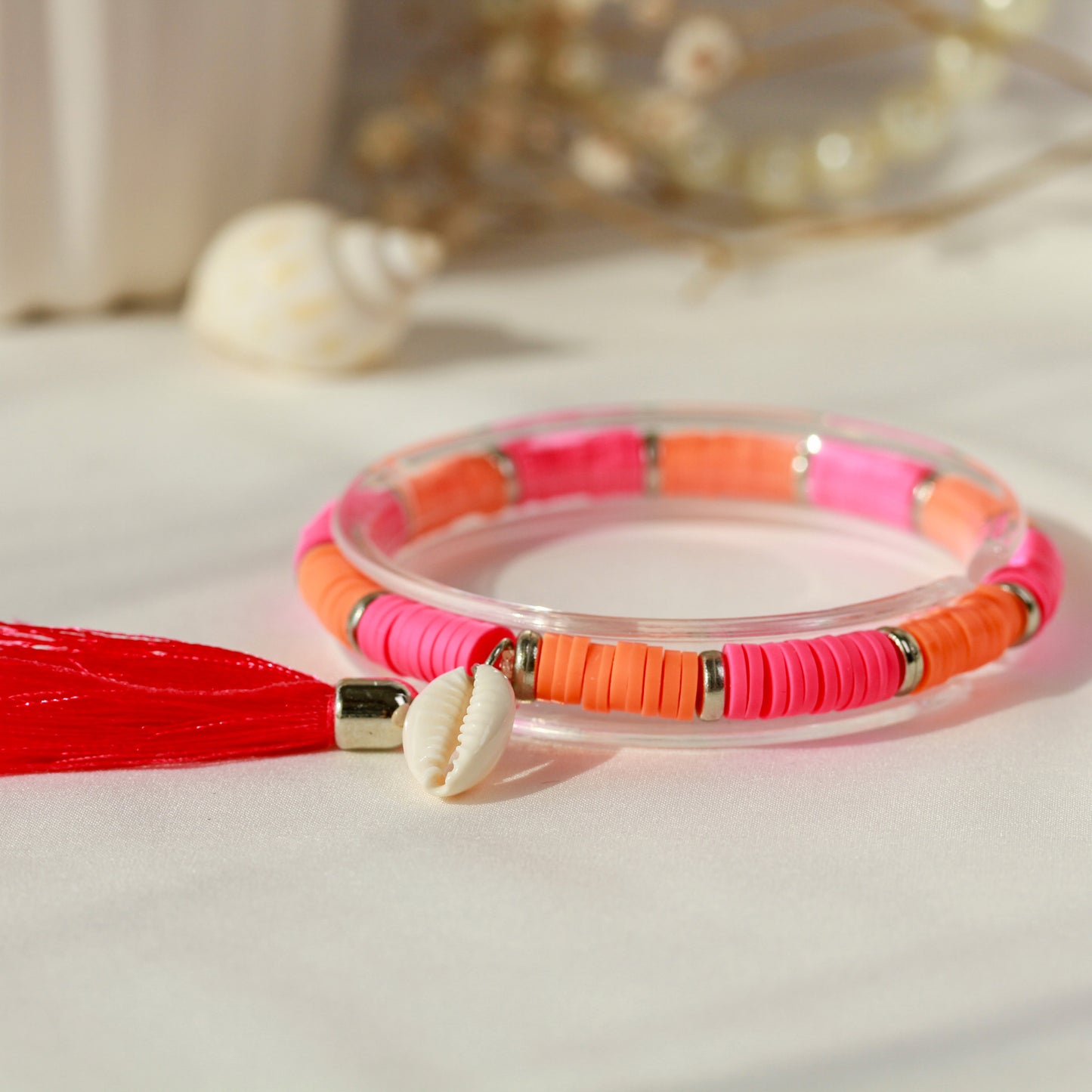 Sunset Shell – Katsuki-Armband in Neon-Pink und Orange mit Kauri-Muschel