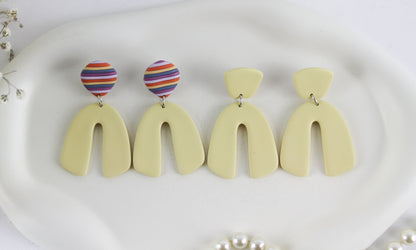 Gelbe Bogen-Ohrringe – Handgemachte Statement-Ohrringe aus Polymer Clay