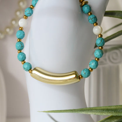 Eudora Curve – Türkises Armband mit goldenem Bogenelement