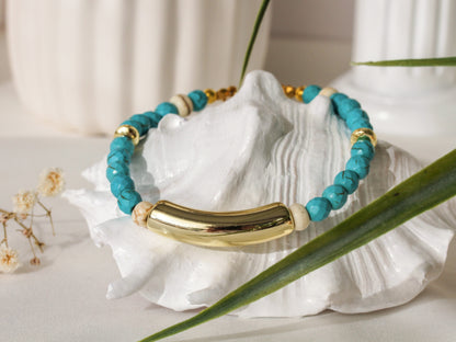 Brizo Arc – Türkises Armband mit goldenem Bogenelement