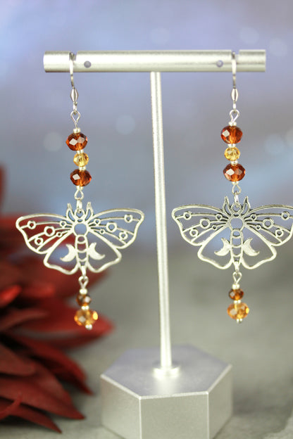Silver Butterfly Ohrringe mit gelb-braunen Kristallperlen – Amberwing Kollektion