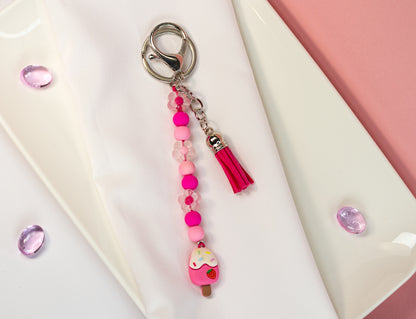 Happy Creamy Schlüsselanhänger - Perlen, Charm & Quaste